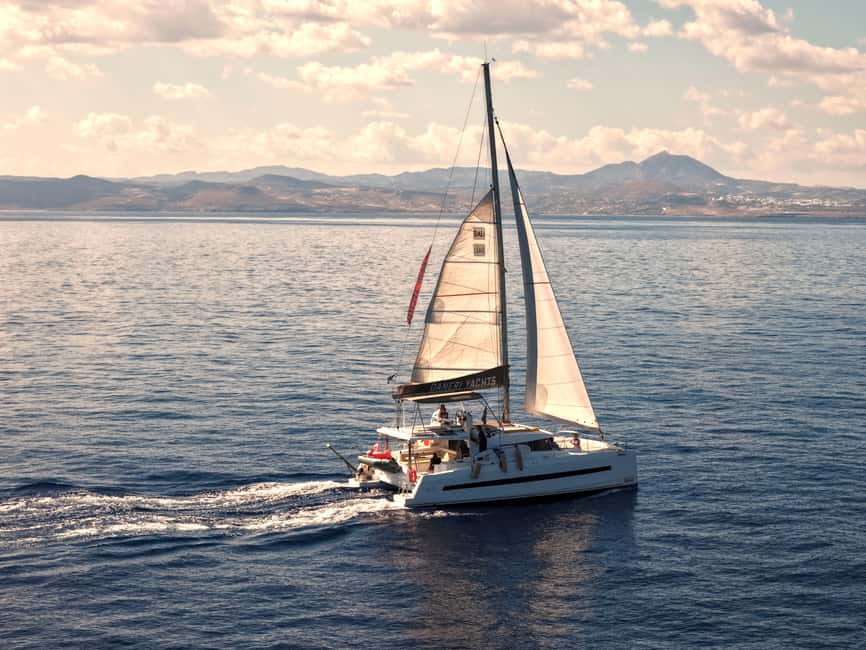 Hersonissos: Sunset Catamaran Cruise with Snacks and Drinks - The 3.5-Hour Route: From Hersonissos Port to Agios Georgios Bay